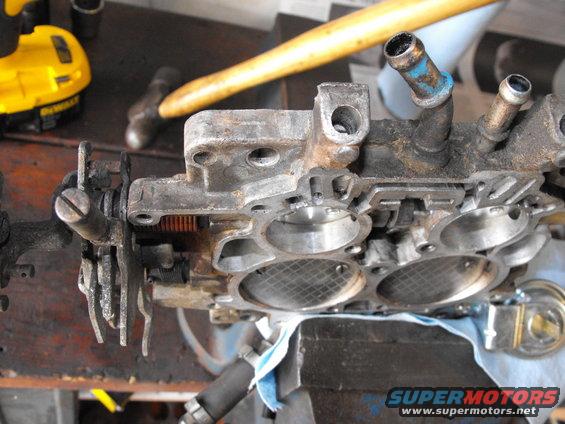 dscf1682.jpg The area to the left of the unblocked idle mixture screws is cleaned off and ready to drill