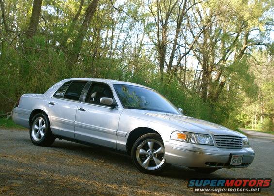 Silver 2000 Ford Crown Victoria 3q-front view with Bullitt wheels