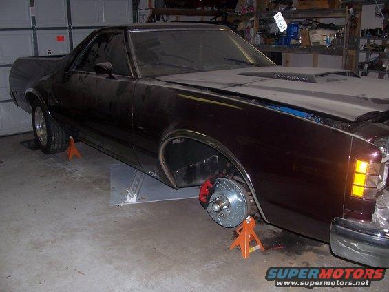 ranchero-brake--engine-030.jpg My work in process, had to put on jackstands because I was afraid of it growing roots. LOL The Ranchero was painted in '98 and had all emblem holes filled, shaved the door handles, the color is black cherry with a touch of pearl in the clear coat. Newly chromed bumpers, tail light bezels and NOS wheel well moldings($$$ Ranchero bucks). Yea, it's dirty.