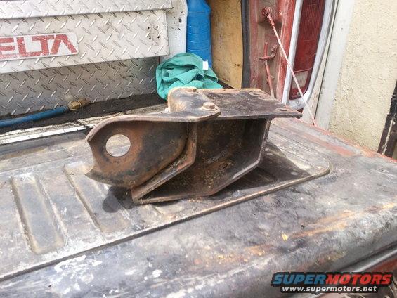 Rusted metal bracket on a truck bed, with DELTA logo visible