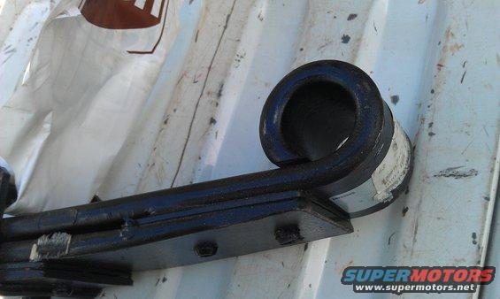 Close-up of a vehicle leaf spring with a label attached