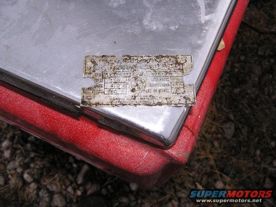 coca-cola-(8).jpg it reads:

Westinghouse

Refrigeration Unit Model L-25
Style 1139532   ???  026130
Volts 110            Test Pressure 200
Amps 4.0           Refrigerant F 12 (R-12?)
Cycles 60          lbs of Refrigerant   .63

??? of patent
Westinghouse Electrical & Manufacturing Company
East Springfield  ????, Springfield ??
