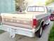 1985 Ford F-250 - This 1985 Ford F-250 pickup truck is seen from the rear, a two-tone paint scheme and a chrome bumper.