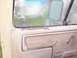 1985 Ford F-250 - Close-up of a worn interior door panel and window frame.