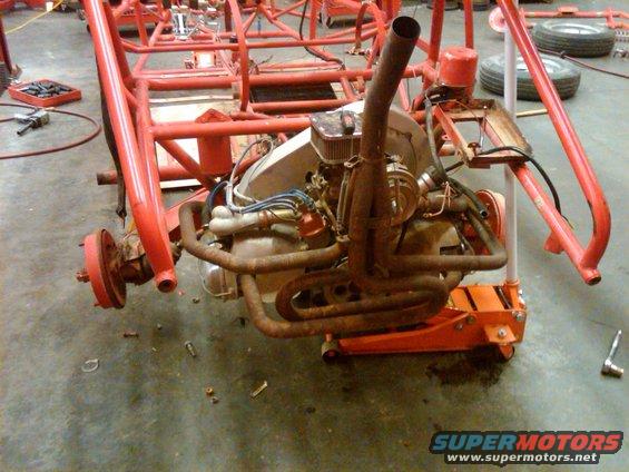 VW engine mounted in a red tube frame, possibly for a dune buggy project