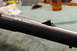 1991 Ford Bronco - Close-up view of a rifle's receiver and barrel, showing the rear sight assembly.