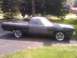 1969 Ford Ranchero - A 1969 Ford Ranchero pickup truck is parked on a driveway, appearing to be in the process of restoration.
