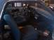 1969 Ford Ranchero - The interior of a 1969 Ford Ranchero features blue upholstered seats and a dashboard with three prominent circular air vents.