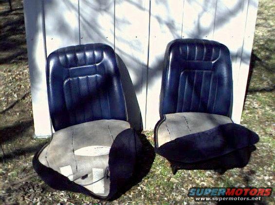 Two dark blue bucket seats with light gray fabric bottoms