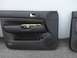 2001 Volkswagen Jetta - A black car door panel, likely from a Volkswagen Jetta, is shown with its internal components exposed.
