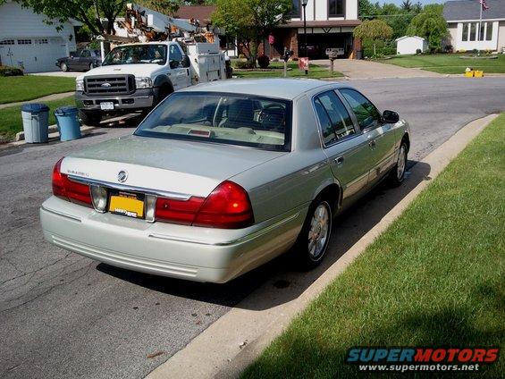 Rear view of silver 2004 Mercury Grand Marquis parked on street