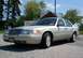 2004 Mercury Grand Marquis - Tan 2004 Mercury Grand Marquis sedan parked outdoors on a paved surface.
