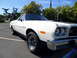 1973 Ford Ranchero - White 1973 Ford Ranchero with black hood accent and chrome bumper.