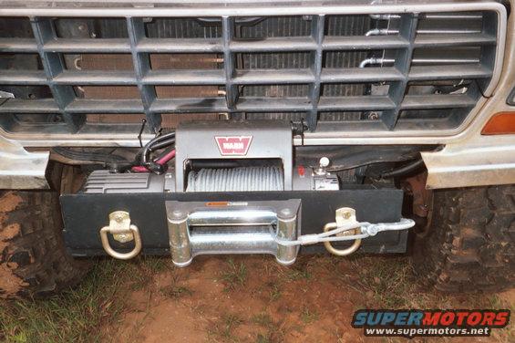 Winch and tow hooks mounted on vehicle's front bumper