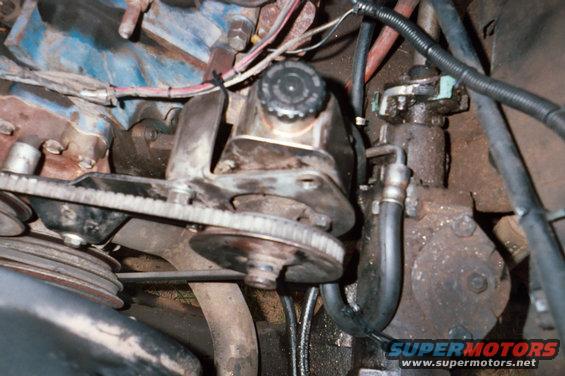 close-up of vehicle's power steering pump, belt, and pulleys