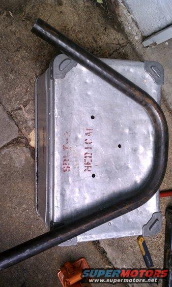 Metal box with 'MEDICAL' stenciled on it, and a bent metal tube resting on top