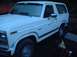 1978 Ford Bronco - This white 1978 Ford Bronco is shown from a 3/4 front angle, highlighting its classic body style.
