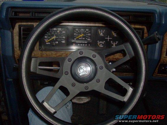 1986 Ford Bronco interior with Grant steering wheel and wood-grain dash