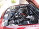 2000 Ford Crown Victoria - The engine bay of a red 2000 Ford Crown Victoria, an aftermarket air intake system.