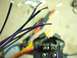 2002 Toyota 4Runner - A crimping tool is shown with various exposed wires, likely for an automotive stereo installation.
