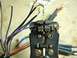 2002 Toyota 4Runner - Close-up of a wire stripper tool working on electrical wires.