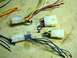 2002 Toyota 4Runner - Multiple wiring harness connectors with various colored wires are laid out on a textured surface.