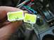 2002 Toyota 4Runner - Two yellow wiring harness connectors are held in hand, with a tangle of colorful wires visible.