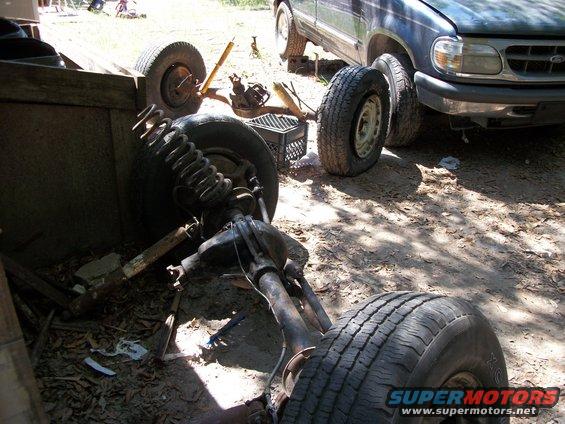 Ford Explorer front suspension and axle removed, with another Explorer in background