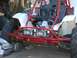 1981 Honda 250 R - A red and white dune buggy sits in an outdoor area with various items around it.