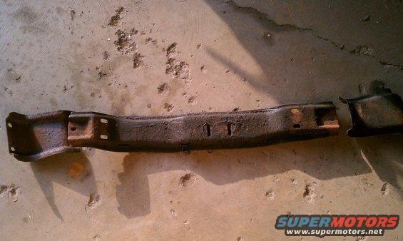 Rusted metal frame part on concrete