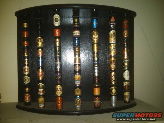 Humidor display case filled with cigar tins
