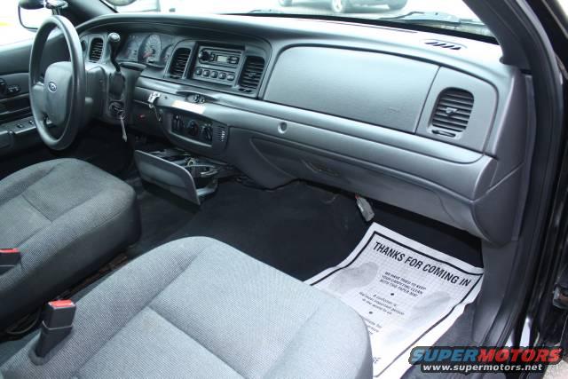Interior of a 2005 Ford Crown Victoria, showing dashboard and seats
