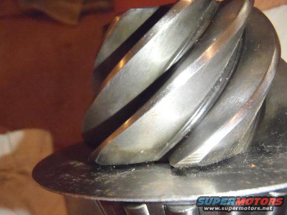 Close-up of a spiral-cut gear, likely from a differential