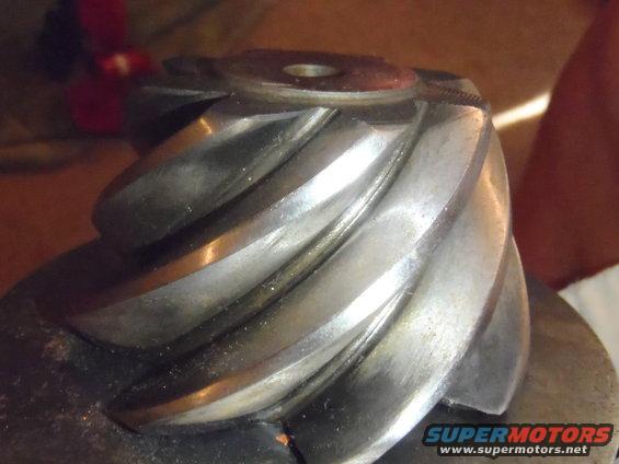 close-up of a metal differential gear with spiral teeth