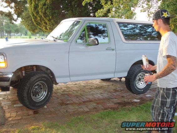 Side view of a 1993 Ford Bronco being prepped for paint