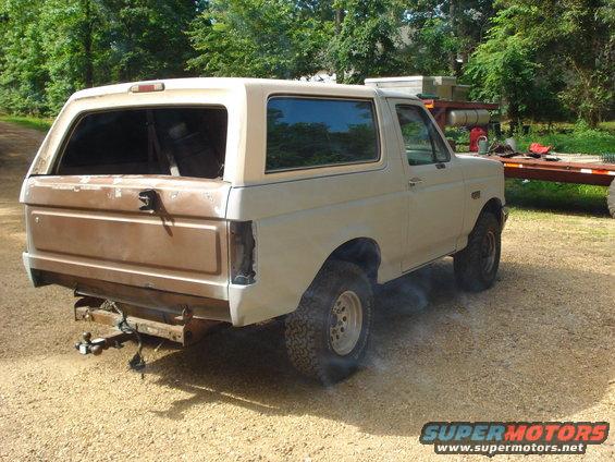 1993 Ford Bronco, rear quarter view, tan
