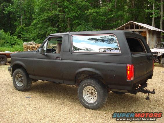 Black 1993 Ford Bronco side view with aftermarket wheels