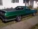 1973 Ford Ranchero - Side view of a green 1973 Ford Ranchero pickup truck.