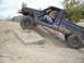 Jeep Comanche going up a ramp, driver visible