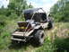 1990 Ford Bronco - This custom vehicle appears to be built for off-road use, with large tires and a frame.
