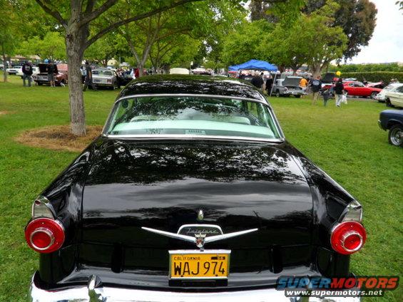 Black 1956 Ford Fairlane rear view with California license plate WAJ 974