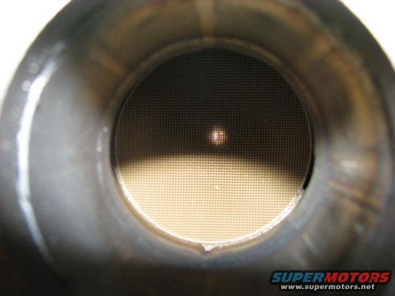 Interior view of a catalytic converter showing the honeycomb structure