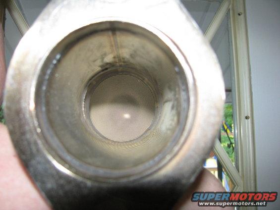 Interior view of a catalytic converter showing the honeycomb structure