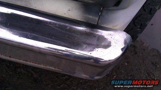 Chrome bumper corner with rust spots and scratches
