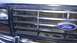 1984 Ford Bronco - Close-up of the front grille and Ford emblem on a Bronco, likely from the early 1980s.