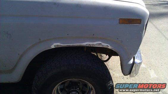 1984 Ford Bronco fender rust repair with primer showing