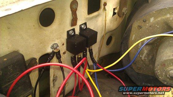 Headlight relays and wiring harness with red, blue, and yellow wires