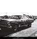 1967 Ford Fairlane - A 1967 Ford Fairlane, likely a drag racer, is seen with prominent "Hooker Headers" and "STP" branding.