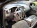 2009 Nissan Murano - The interior of a 2009 Nissan Murano features tan leather seats, a tan steering wheel, and a central infotainment screen.