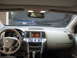 2009 Nissan Murano - Interior view of a 2009 Nissan Murano, showing the dashboard and a blue car parked outside.